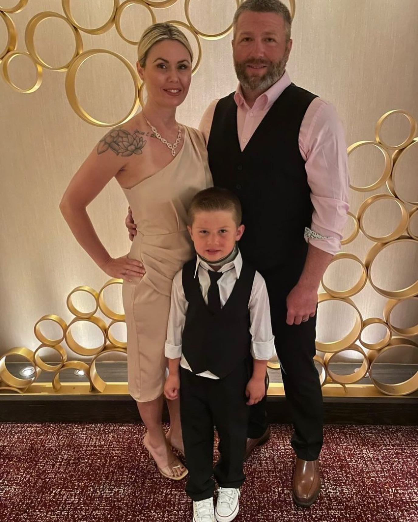 A couple who both had weight loss surgery with us, dressed up for a formal event with their young son