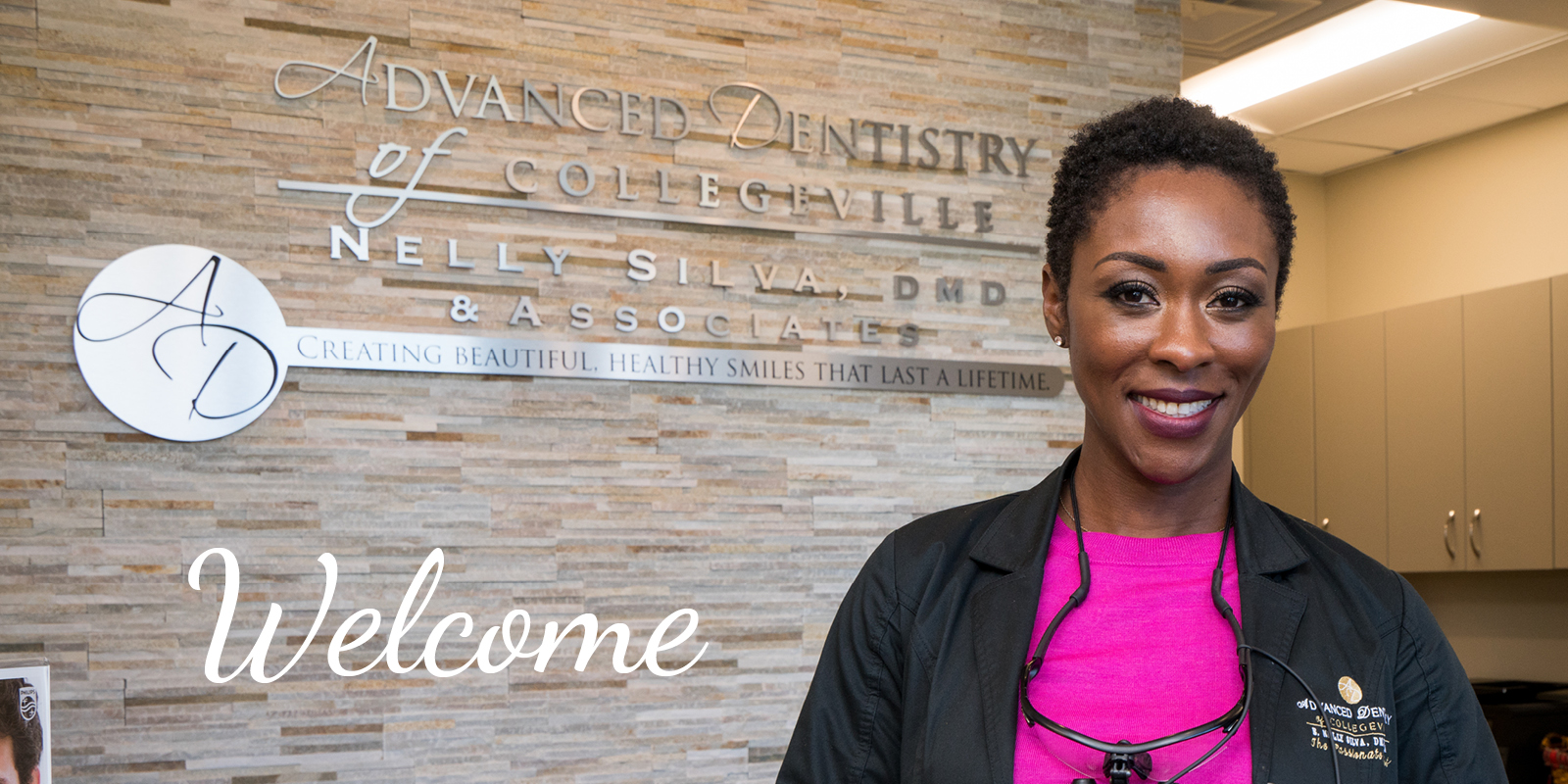 Dr. Nelly Silva, DMD, at the welcome wall of her Collegeville office, where she treats teeth grinding and jaw clenching