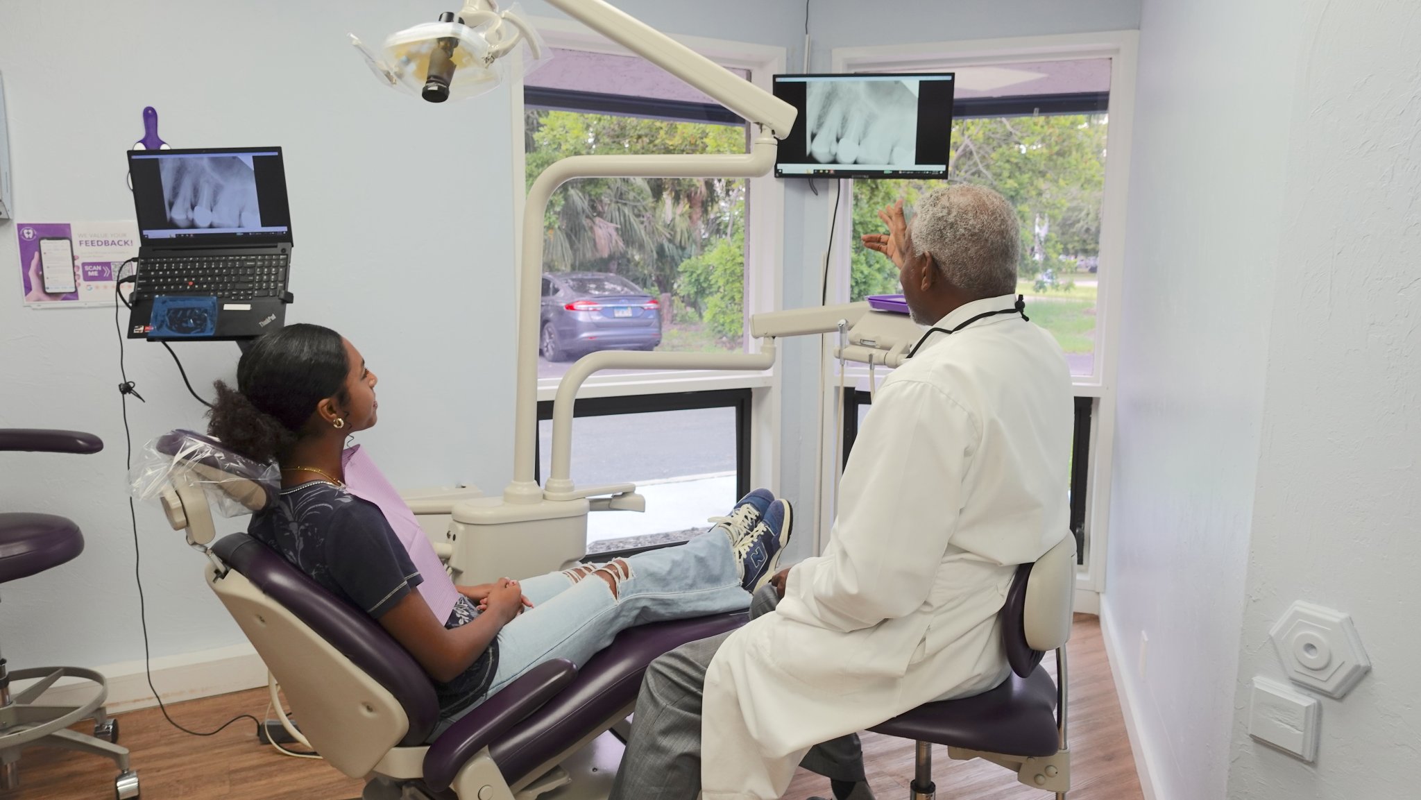 dentist reviewing dental x-rays with a patient