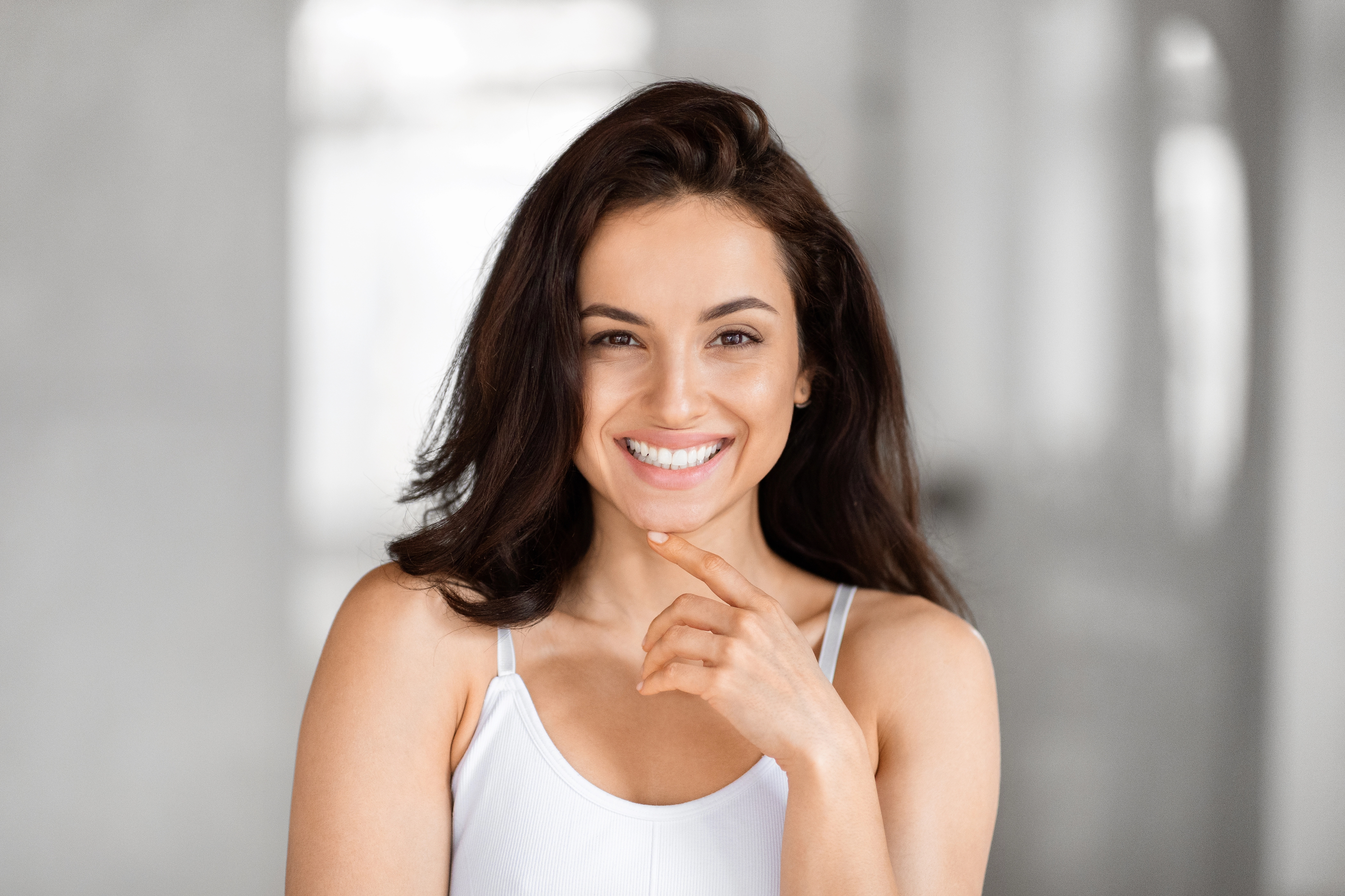 Smiling woman with a healthy smile before a dental exam in Collegeville, PA