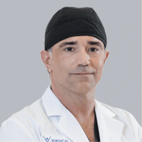 Headshot of Dr. Reza Keshavarzi, MD, FACS, FASMBS, bariatric surgeon, in a white coat and surgical cap