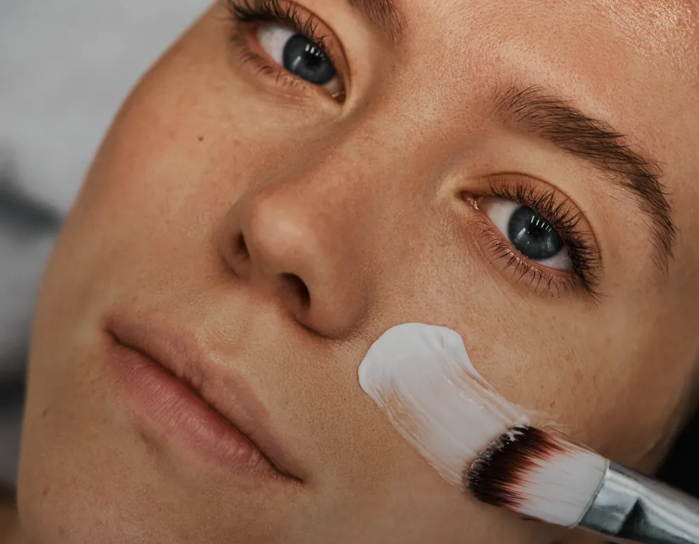 Close-up of a woman with glowing skin after a facial