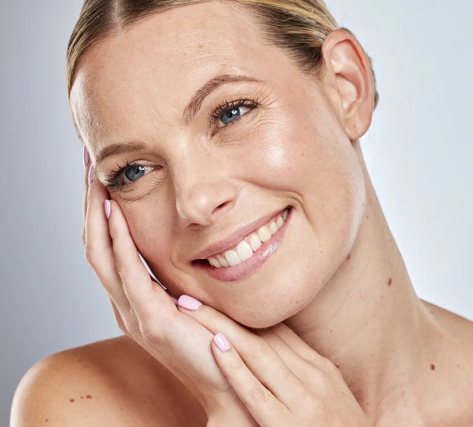 Smiling woman with bright, refreshed skin around her eyes