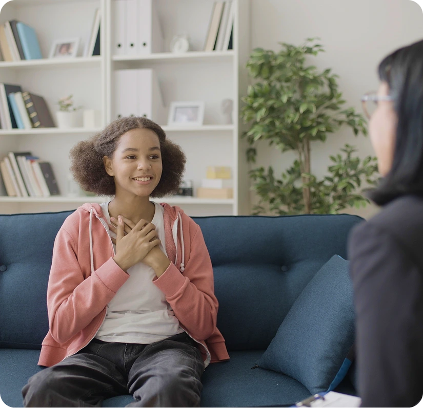 Teen girl talking with a child psychiatrist during an evaluation in Costa Mesa, CA