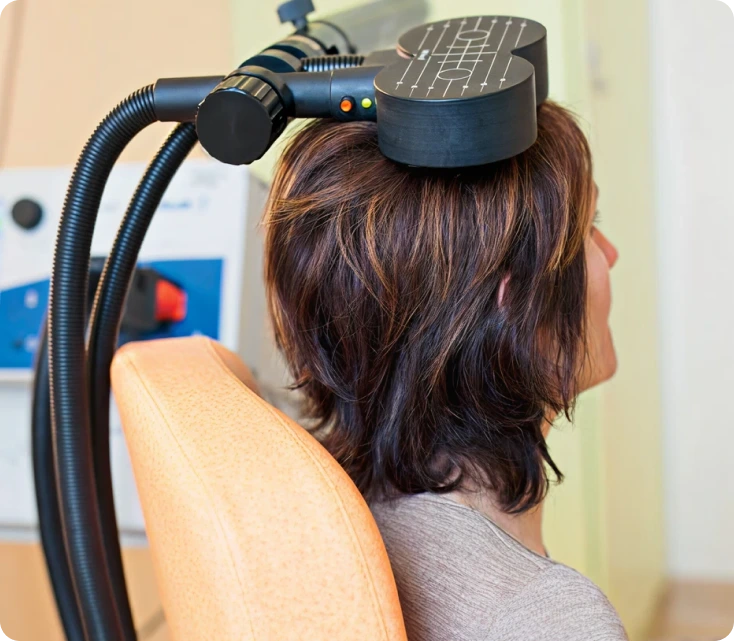 Patient receiving laser hair removal treatment to the back of the neck and shoulders