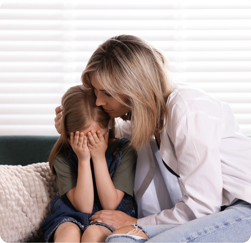 Parent comforting an upset child - signs it may be time to see a child psychiatrist