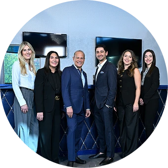 Breast Reduction Center USA team of plastic surgeons and staff posing together in professional attire