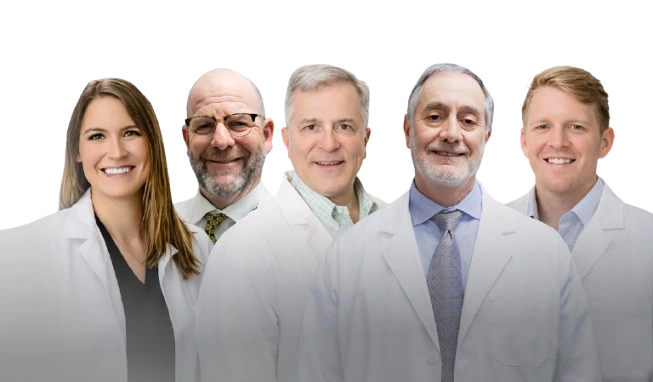 Five Coastal ENT physicians in white coats: Ashley Kraft, M.D., Clay Bratton, M.D., Michael Seicshnaydre, M.D., Vincent Pisciotta, M.D., F.A.C.S., and Robert Wineski, M.D.