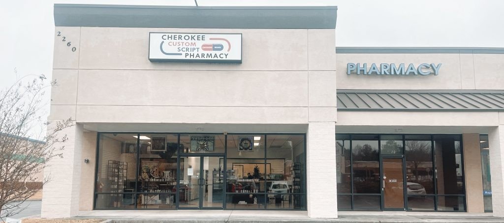 Storefront of Cherokee Custom Script Pharmacy on Holly Springs Parkway