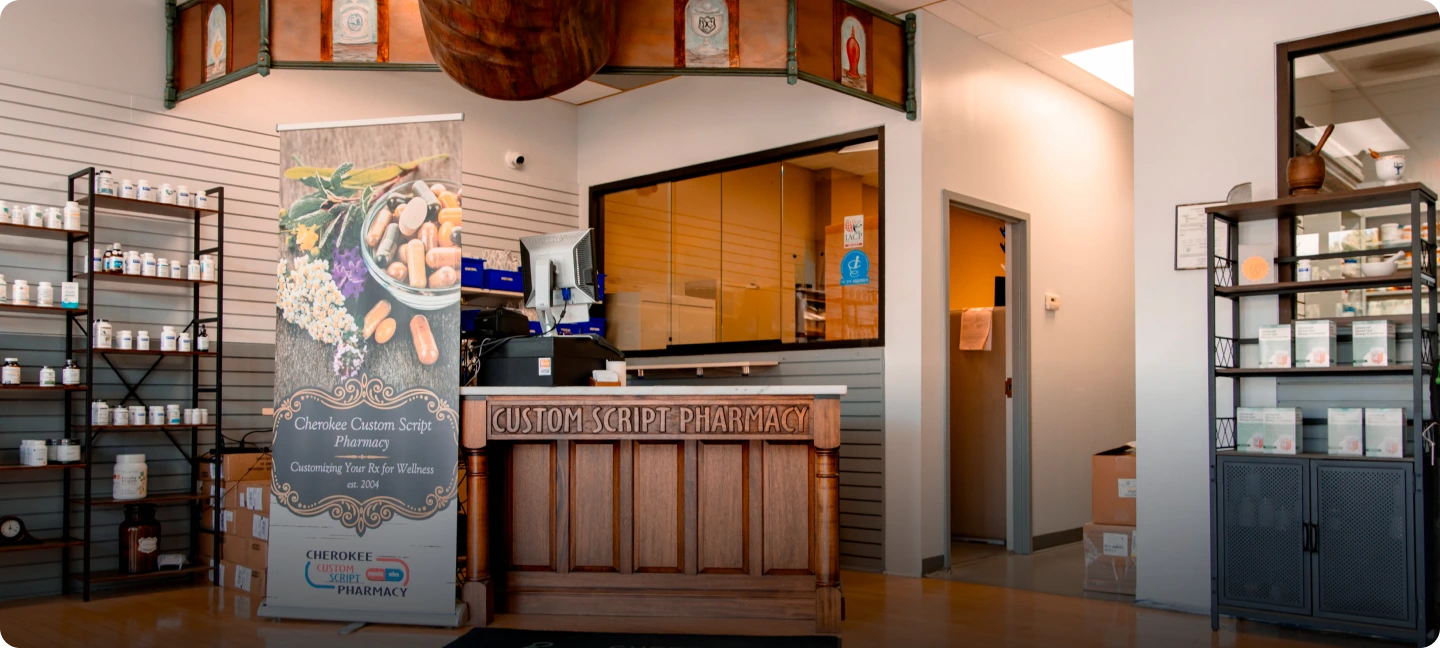 Cherokee Custom Script Pharmacy reception desk and retail shelving displaying medications and wellness products