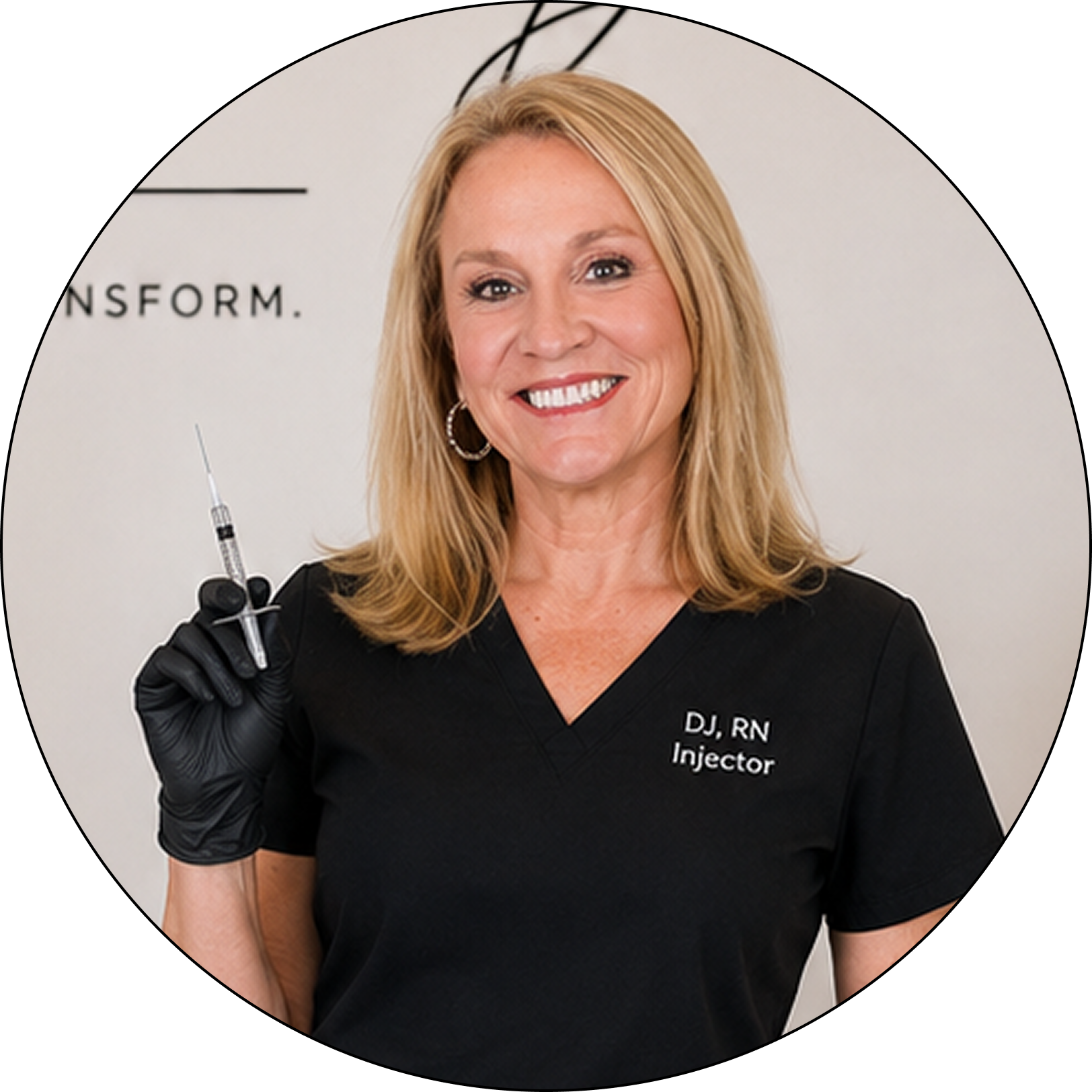 DJ, RN Injector holding a syringe in black gloves, smiling at camera