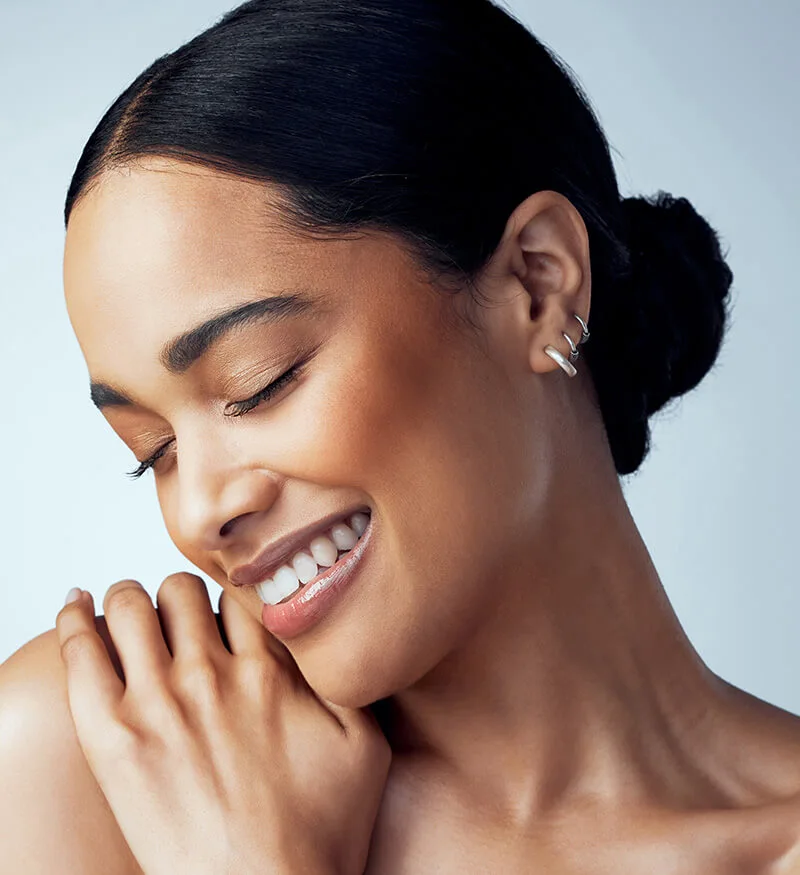 Woman with her hand on her shoulder