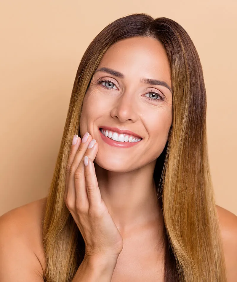 Mature woman touching her chin