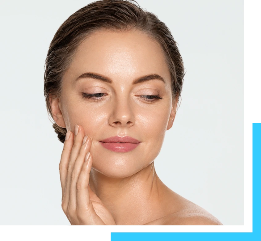 Woman touching her face, demonstrating smooth, tightened skin from non-surgical skin tightening treatment