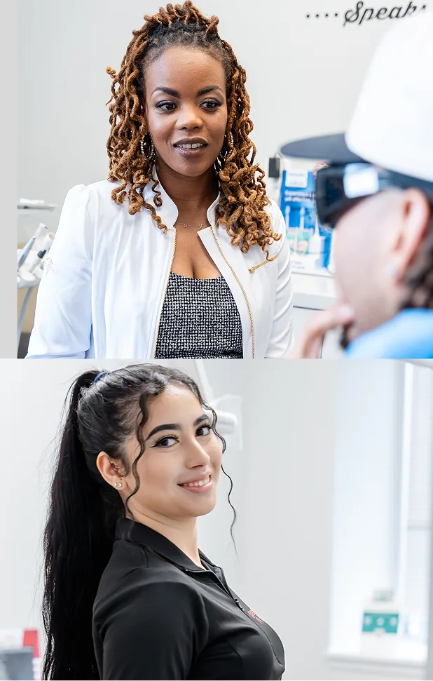 Female healthcare provider in white coat smiling in modern medical office with equipment visible
