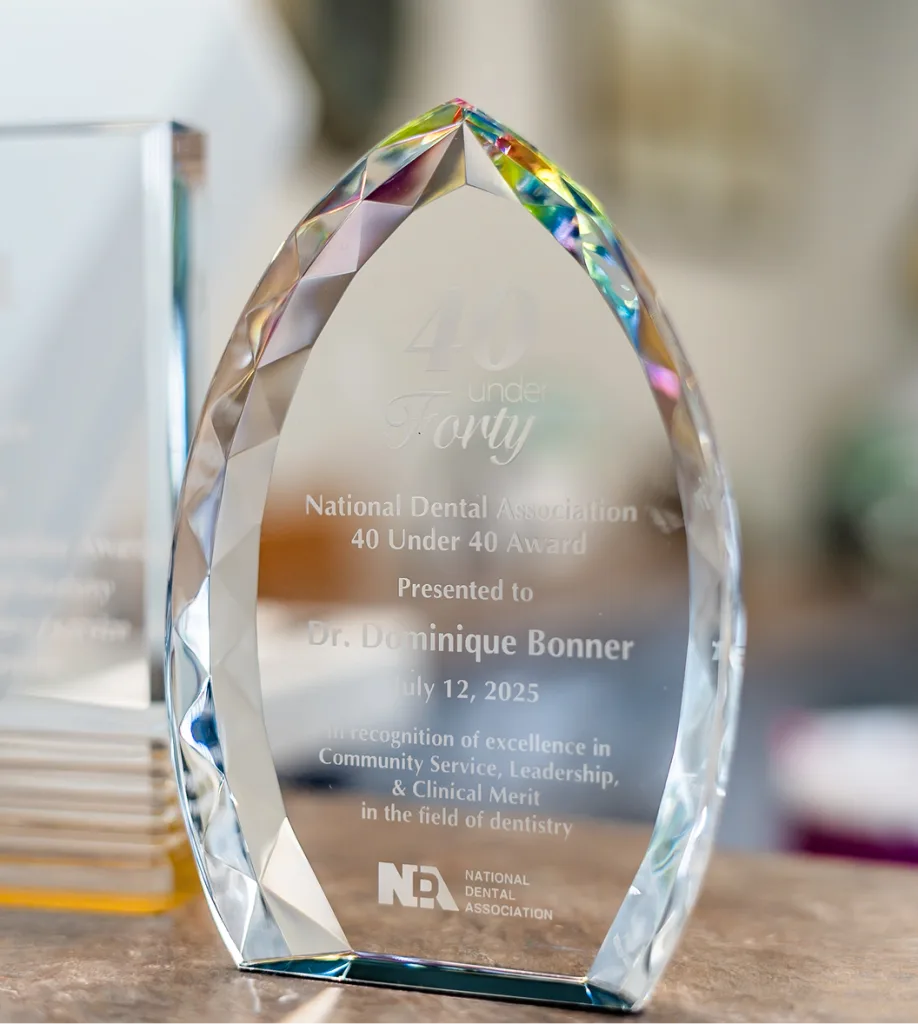 National Dental Association 40 Under 40 Award presented to Dr. Dominique Bonner on July 12, 2025, for excellence in Community Service, Leadership, and Clinical Merit in dentistry