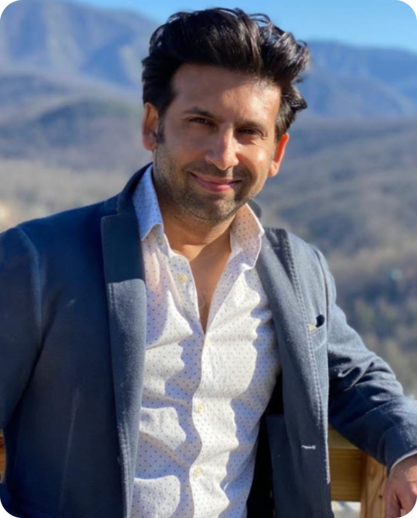 Amit Sharma, Physician Associate at DermaLaser Medpa, smiling outdoors with mountains in background