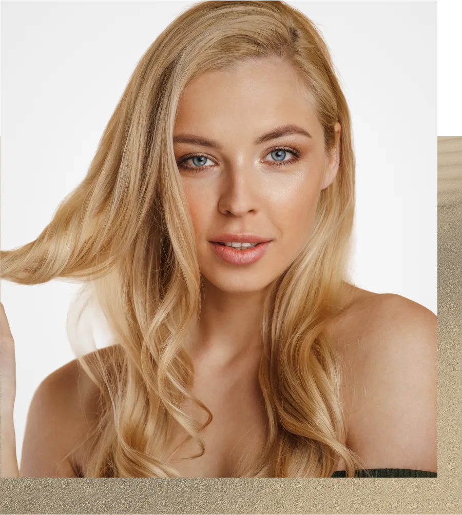 Blonde woman with long wavy hair facing forward against white background