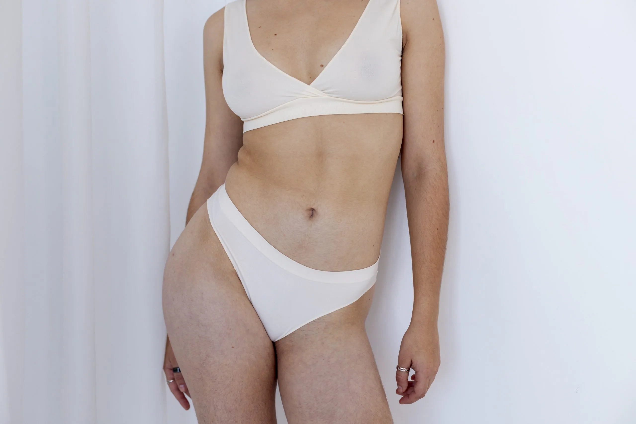 Close-up of a woman's toned midsection - mommy makeover results