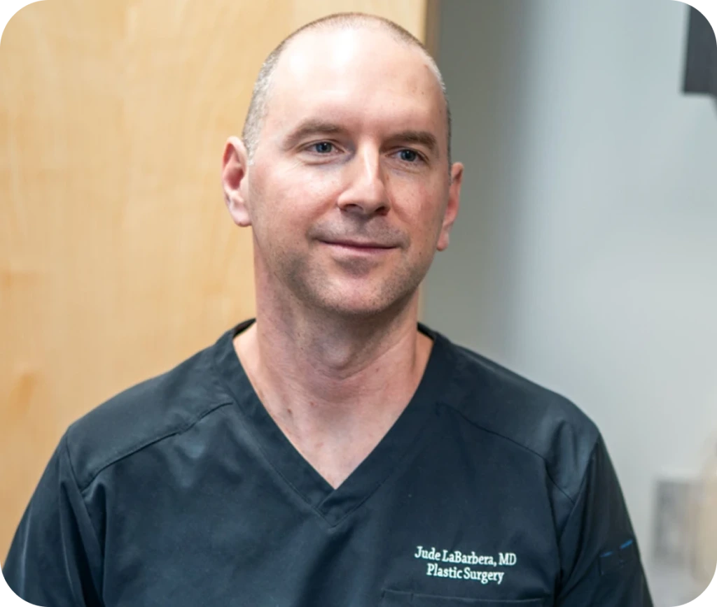 Dr. Jude LaBarbera, plastic surgeon, in scrubs at his practice