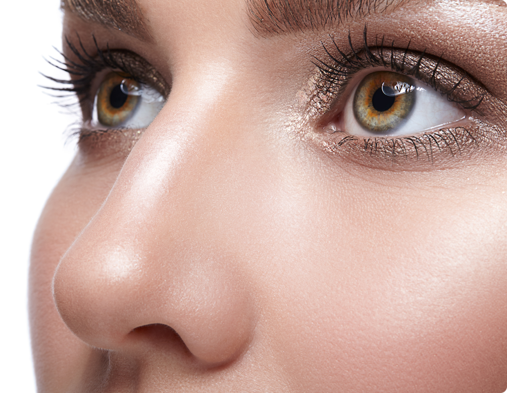 Close-up of a woman's face showing refined nose profile and facial symmetry