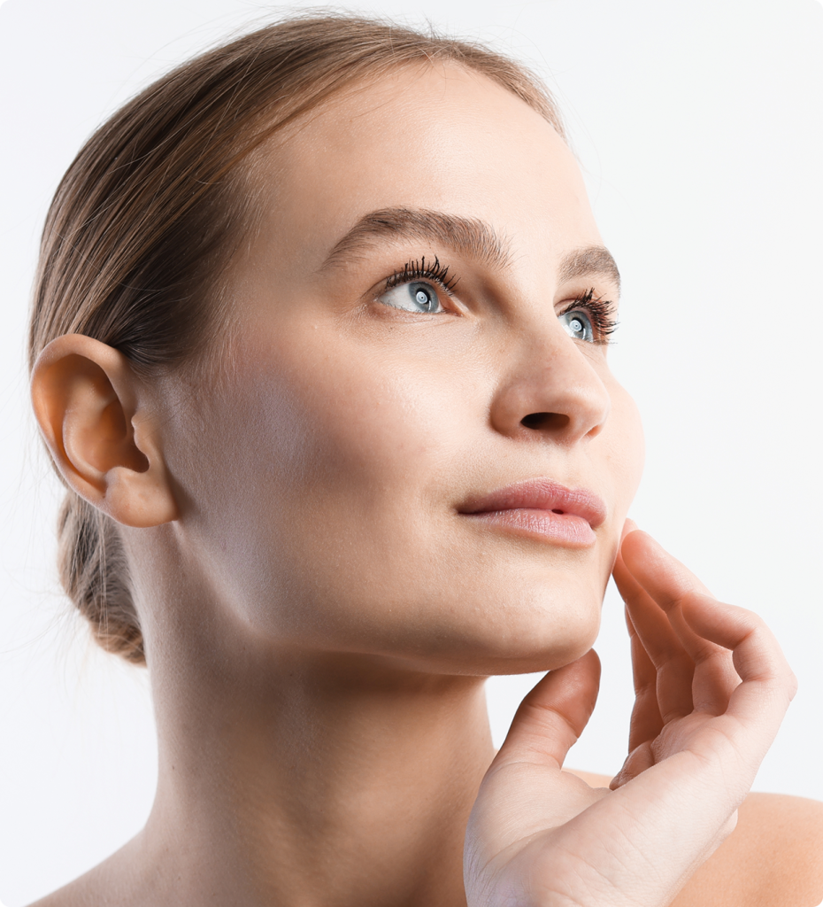 Woman in profile view touching her chin, showing facial contours and nose shape