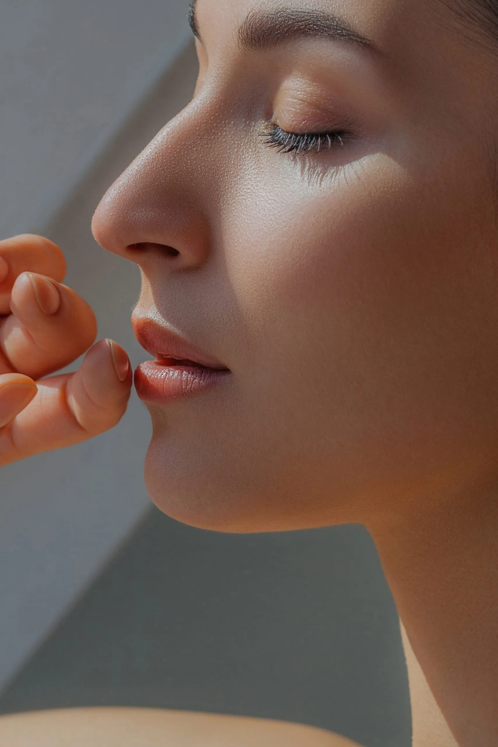 Woman's profile showing smooth, glowing skin on cheek and jawline