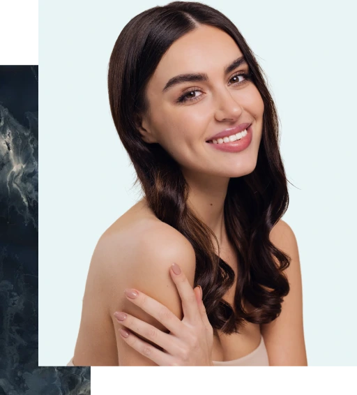 Woman with dark hair smiling at camera with clear skin
