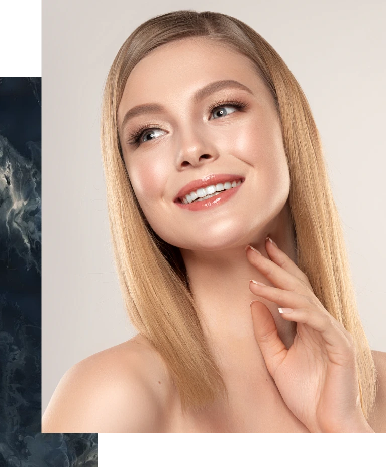 Woman with smooth, radiant skin and defined facial contours smiling at camera