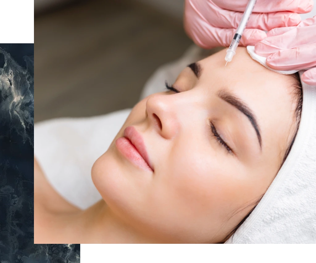 Clinician in pink gloves administering Botox injection to patient's forehead
