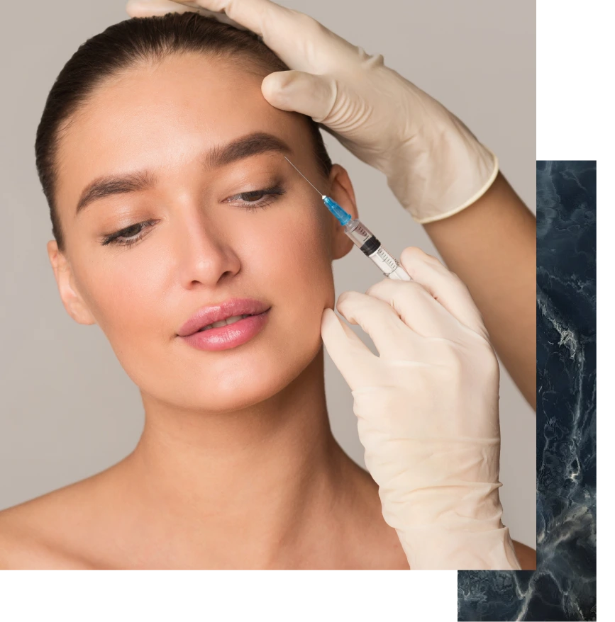 Clinician in gloves administering Botox injection to patient's forehead