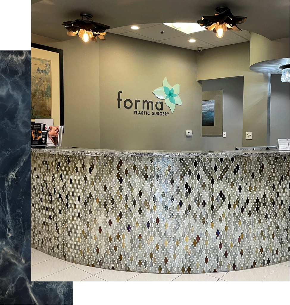 Forma Plastic Surgery reception desk with logo and patterned accent wall