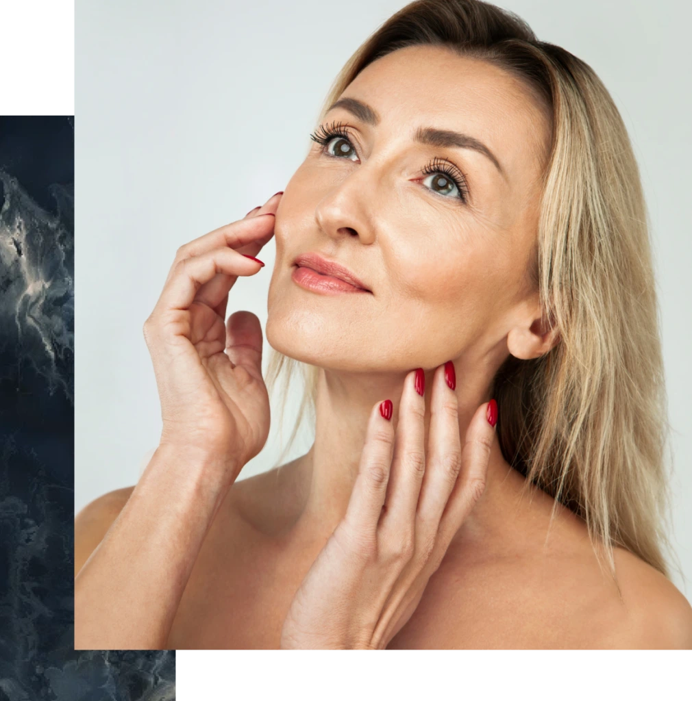 Woman touching her cheek and jawline, demonstrating facial contour