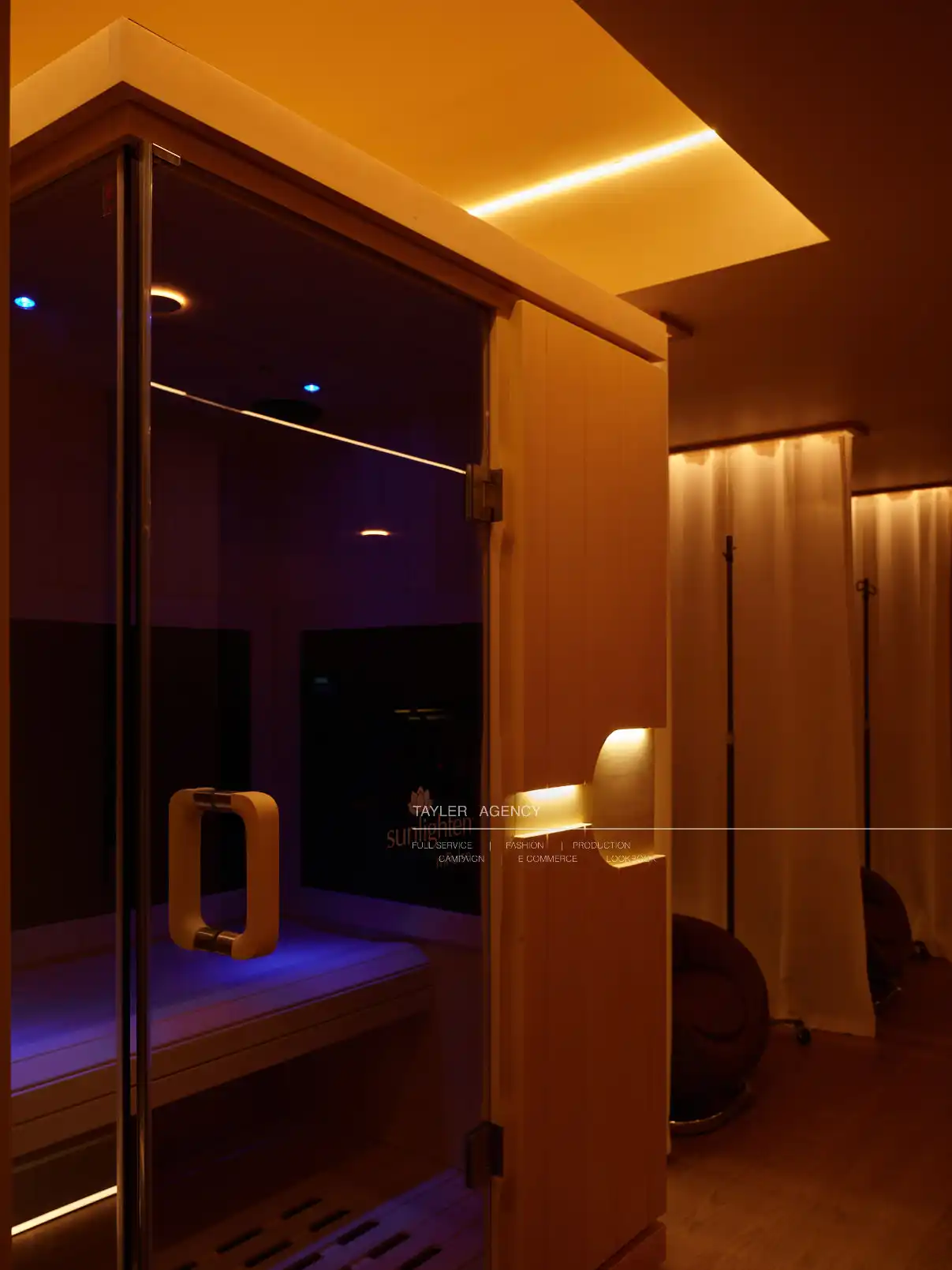 Infrared sauna cabin with glass door and warm wooden interior at La Reservé Aesthetics