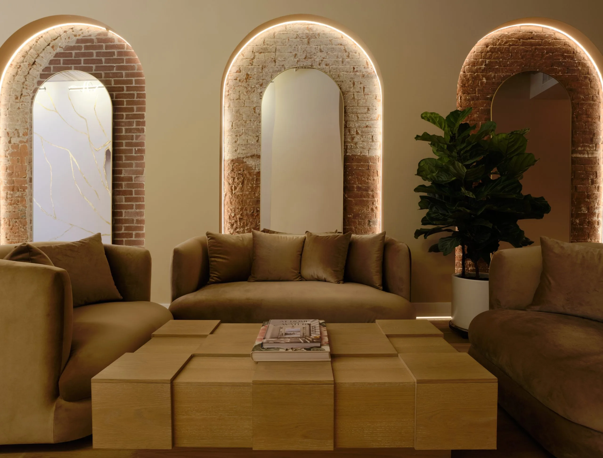 La Réserve spa interior with warm golden lighting, private treatment pods, and lounge seating