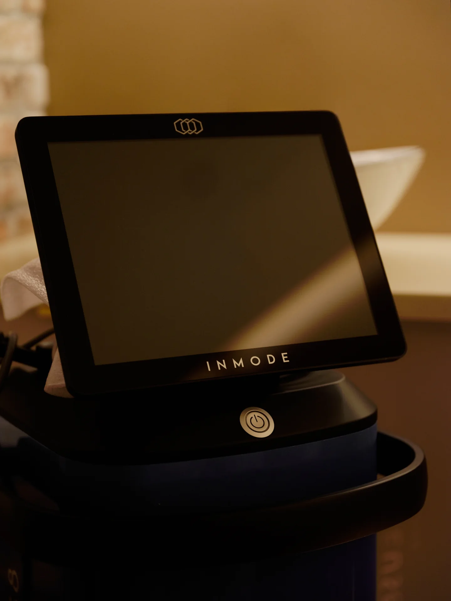 InMode Morpheus8 device in a warm-lit treatment room at La Reservé Aesthetics