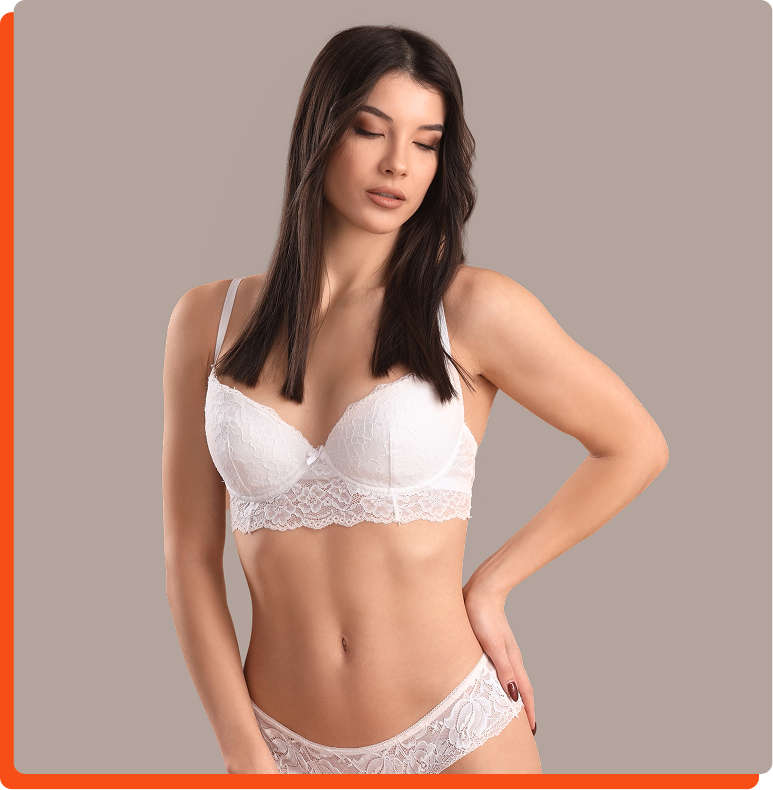Woman demonstrating abdominal contour and results from extended tummy tuck procedure