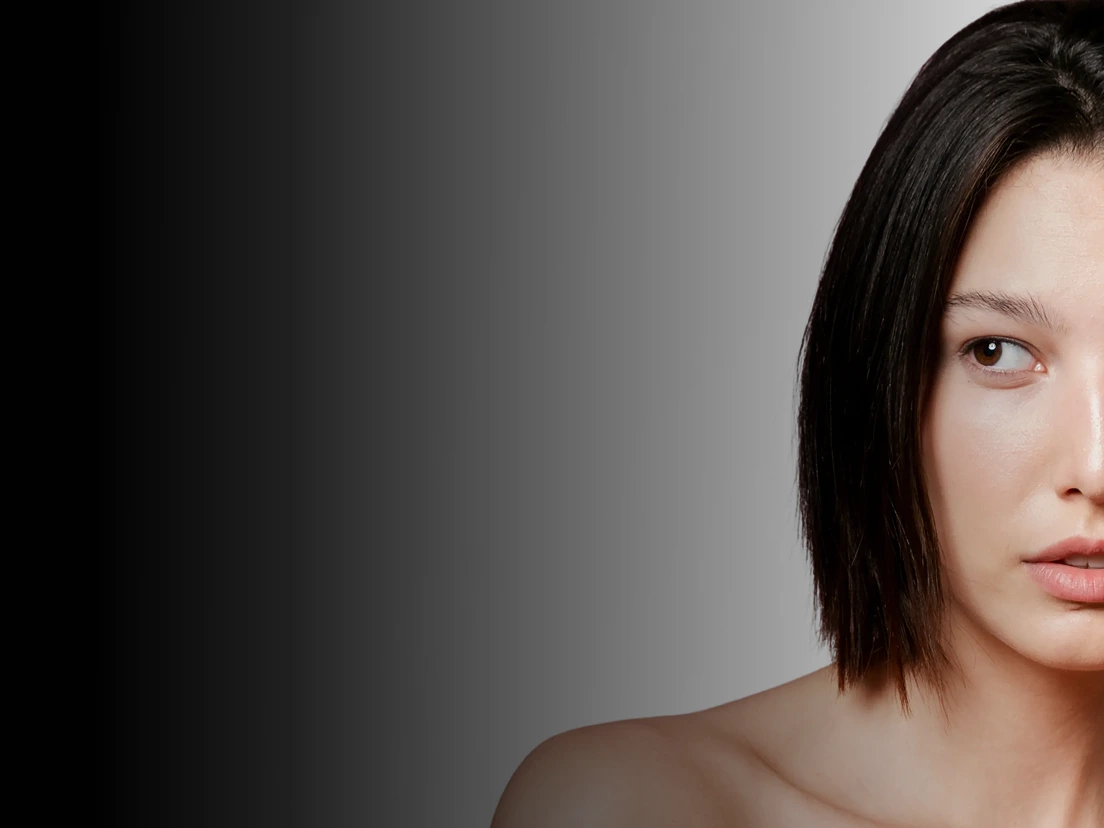 Woman's profile against neutral background, illustrating flat foot or arch collapse concept