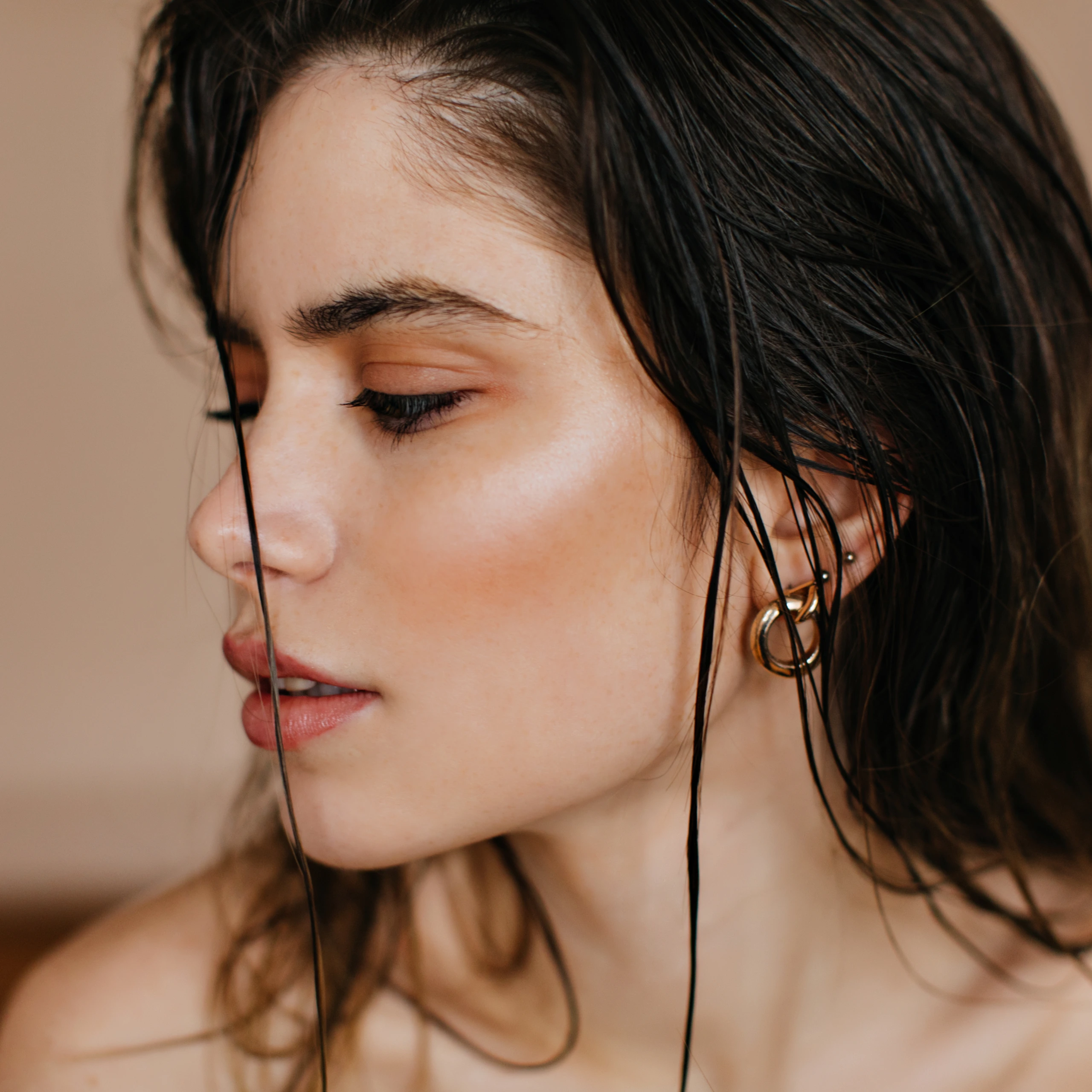 Woman in profile with defined cheekbones and smooth facial contours