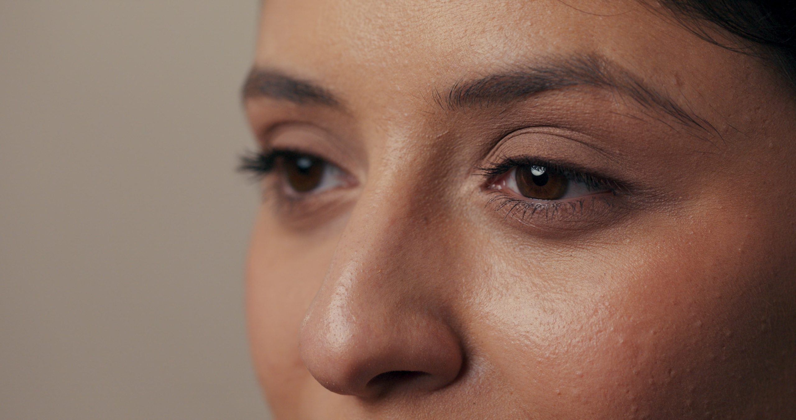 Close-up of person's eyes showing drooping eyelids