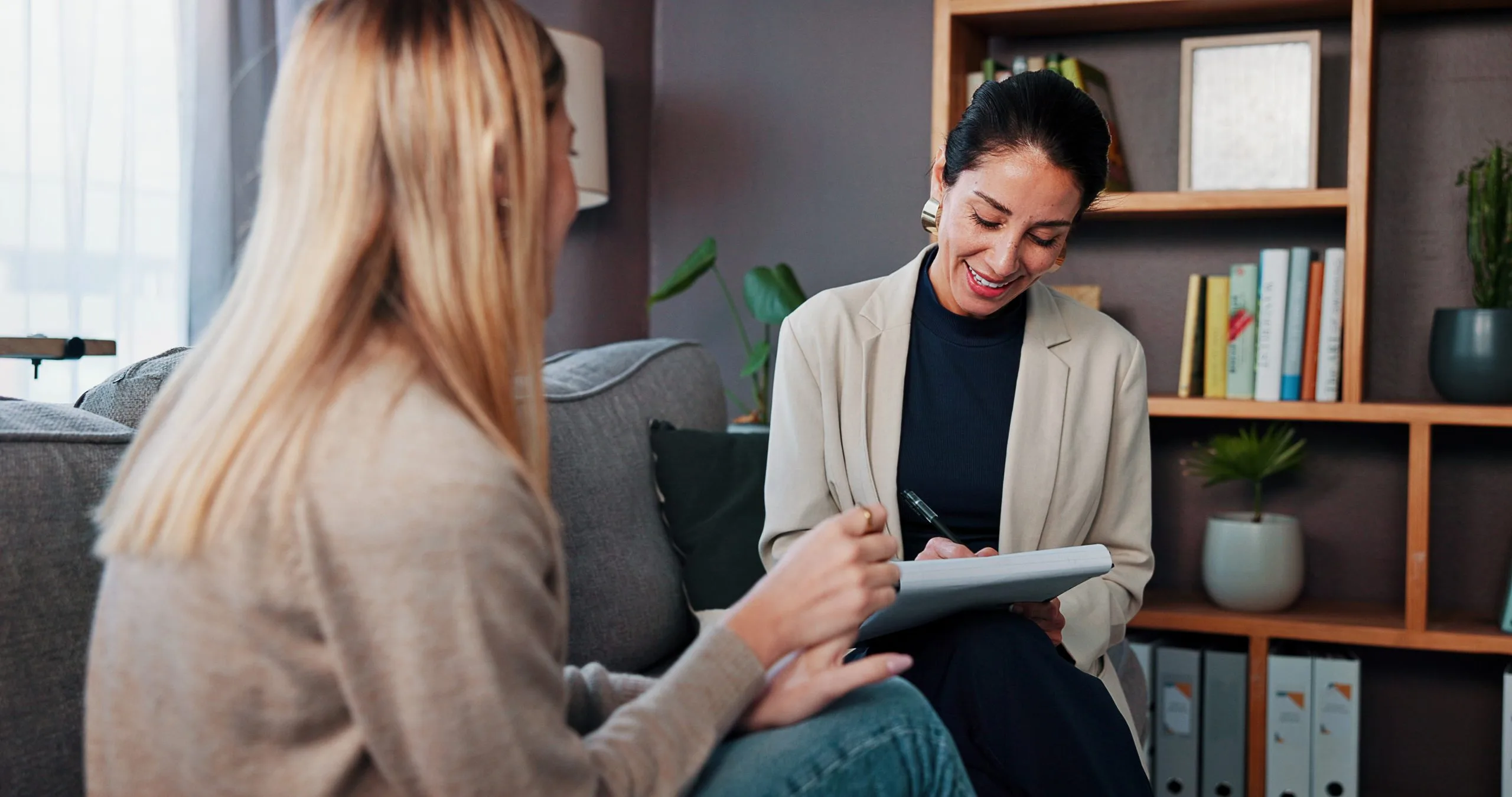 Healthcare provider reviewing tablet with patient in office setting