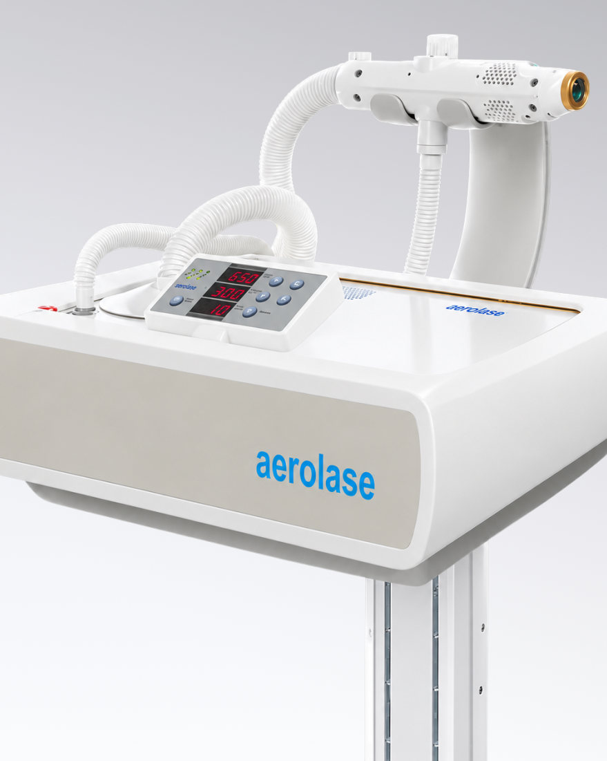 Aerolase laser device on treatment table with handpiece, control panel, and tubing