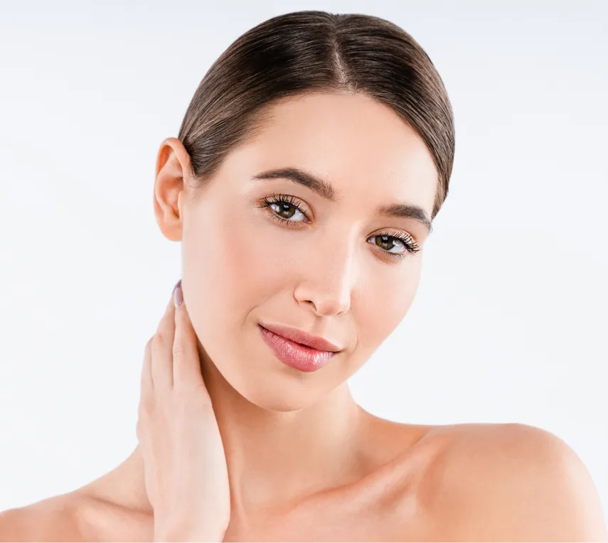 Woman touching her ear, demonstrating ear position for otoplasty consultation