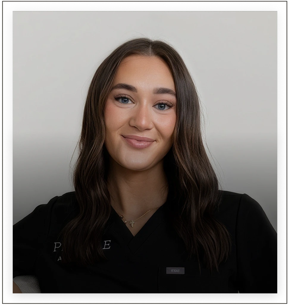 Profile Aesthetics team member in black scrubs against neutral background