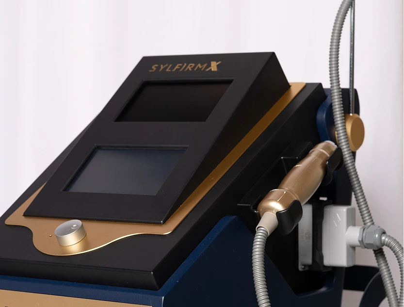 Sylfirm X RF microneedling device with dual display screens and handheld treatment applicator