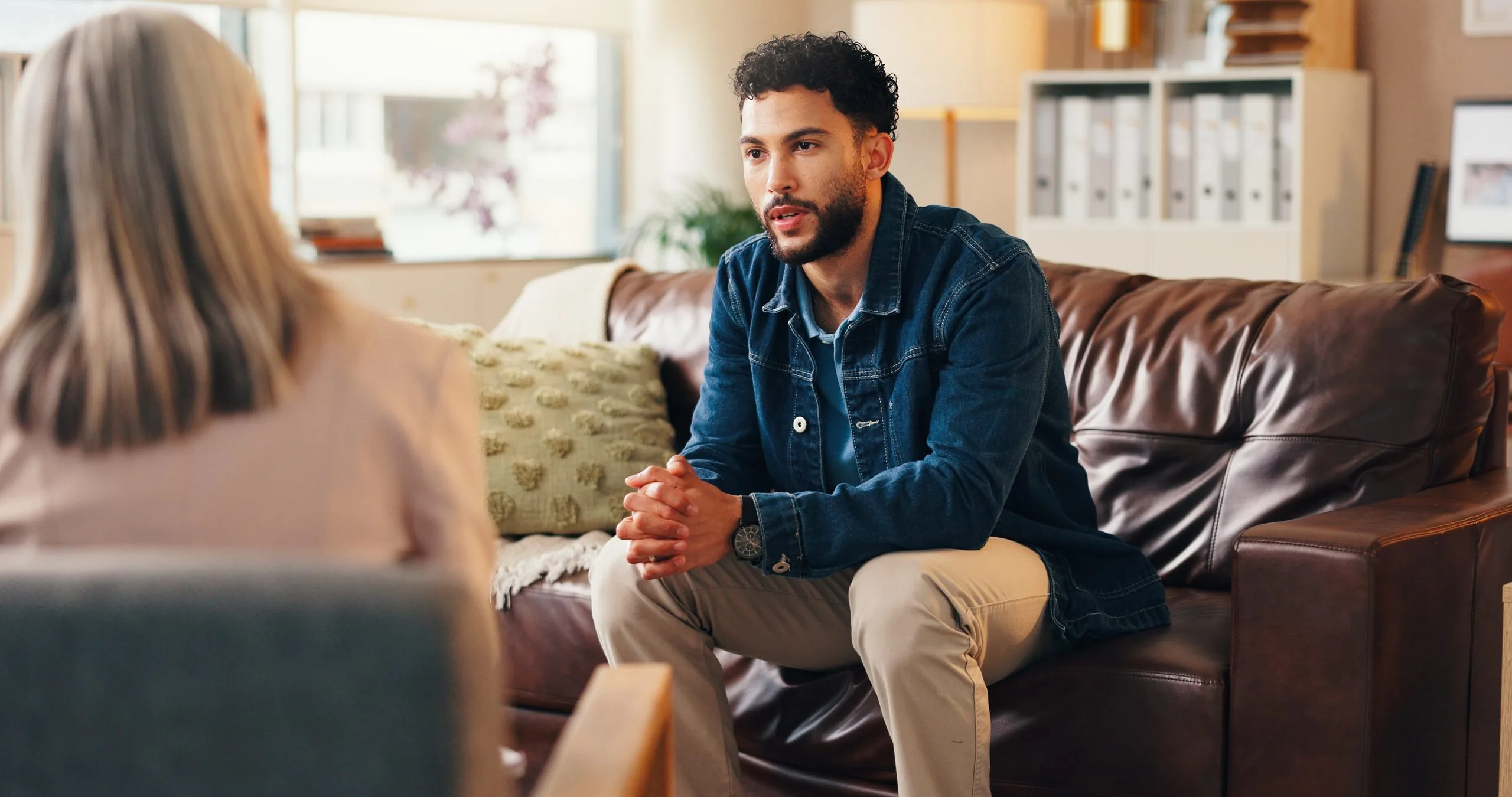 Man speaking with a therapist during a counseling session