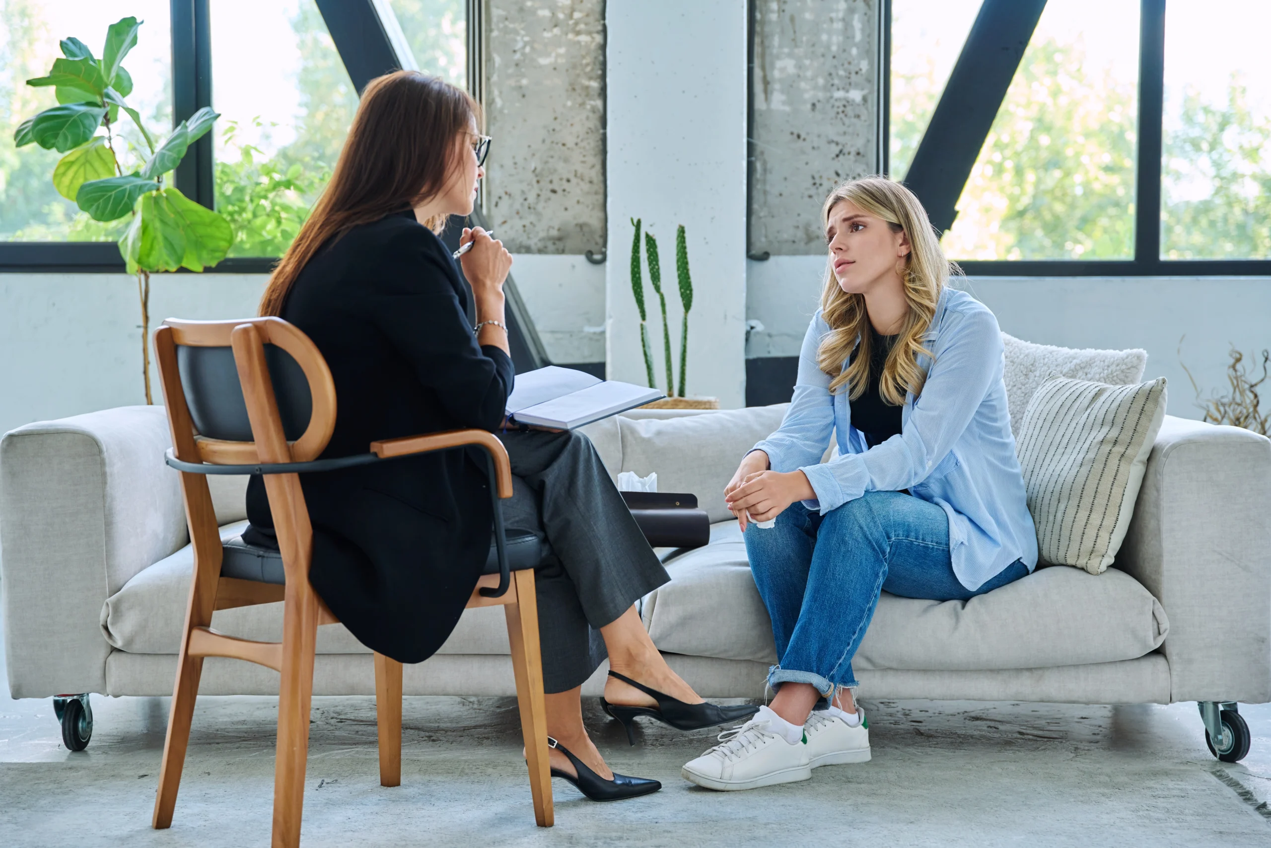 Young woman talking with a therapist during a counseling session
