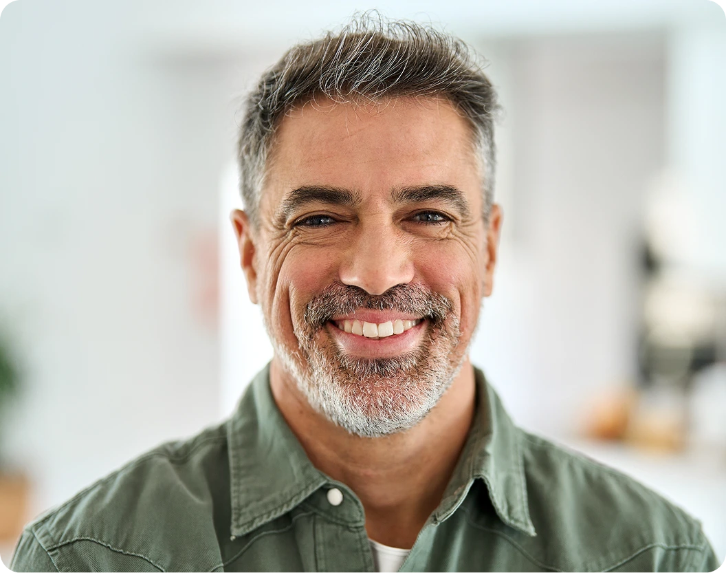 Smiling man in a bright indoor setting