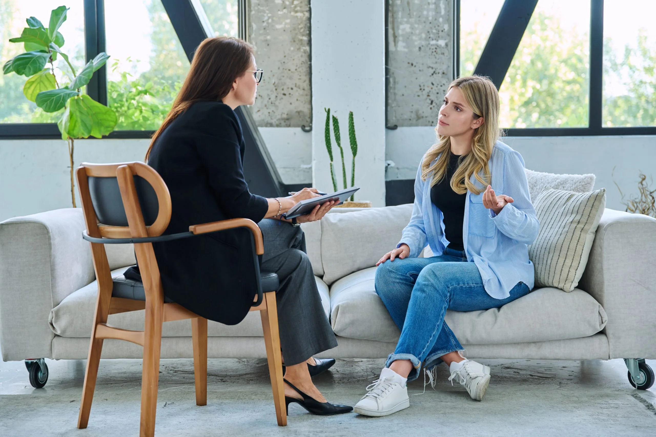 Therapist talking with a client during a counseling session