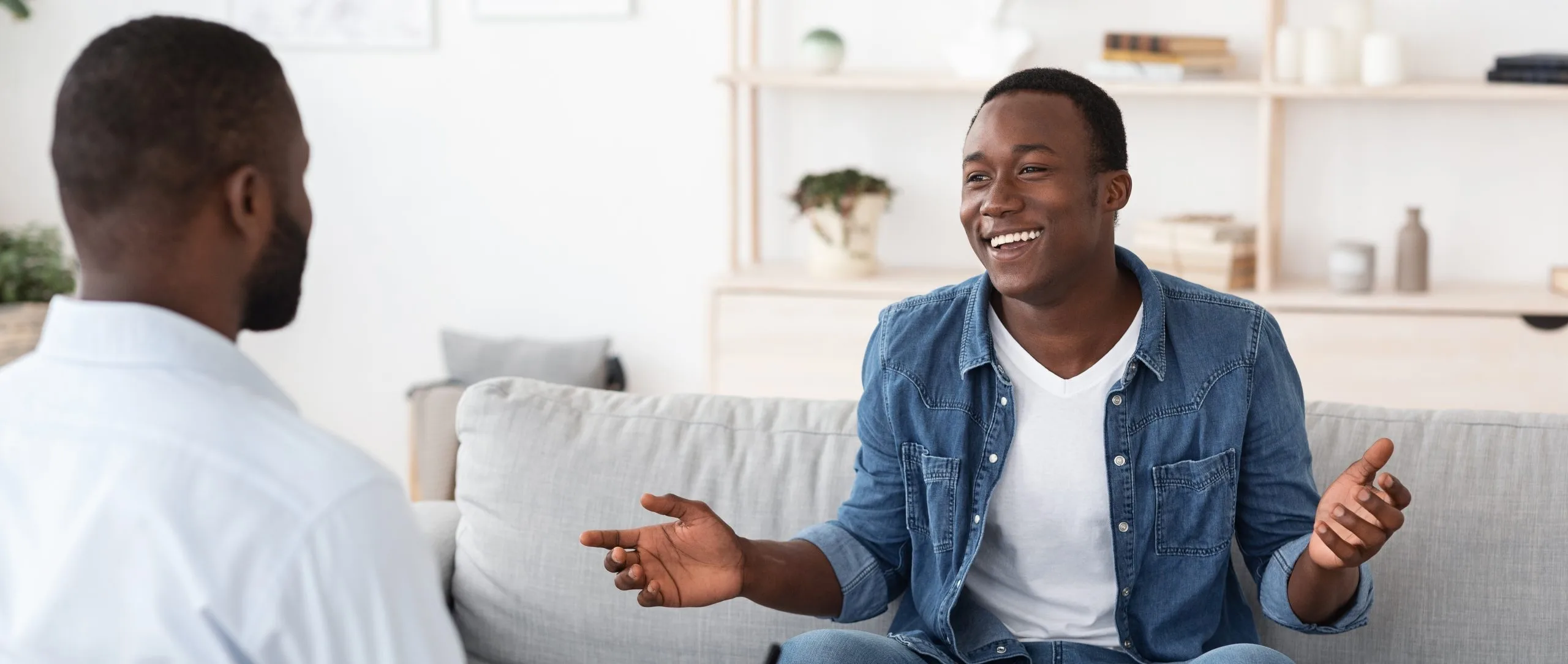 Smiling man talking with a therapist